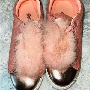 Pink furry tennis shoes.